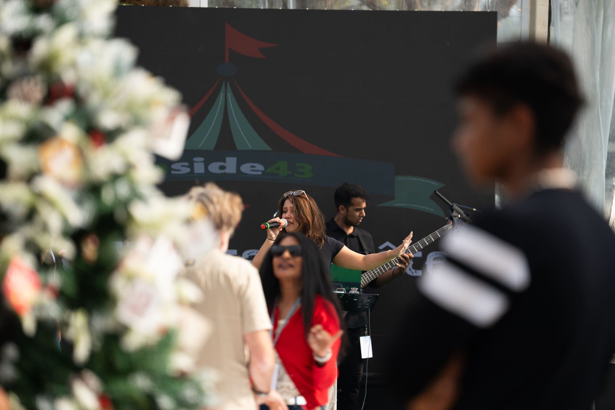 The floral arch at the entrance to the stage lawn